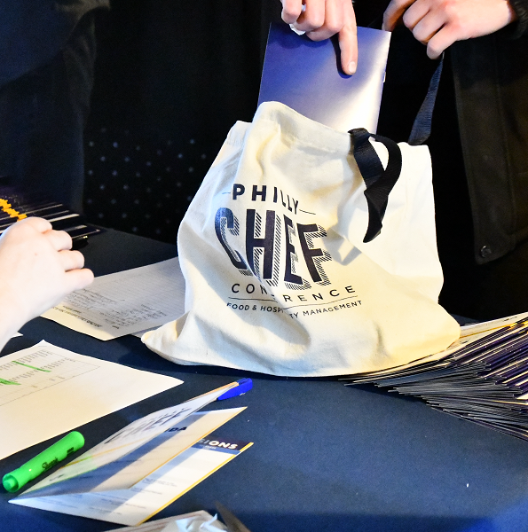 Stuffing a tote bag from Philly Chef Conference